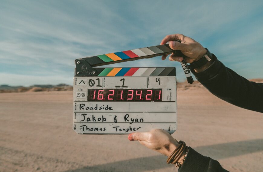 Film Director holding movie clap for start of a new scene.