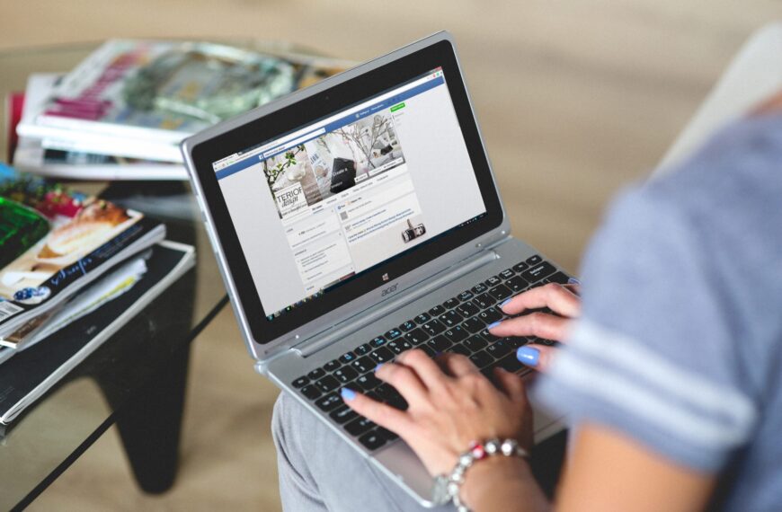 Person using a social media site on a laptop