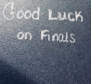 Finals wishes written on desk