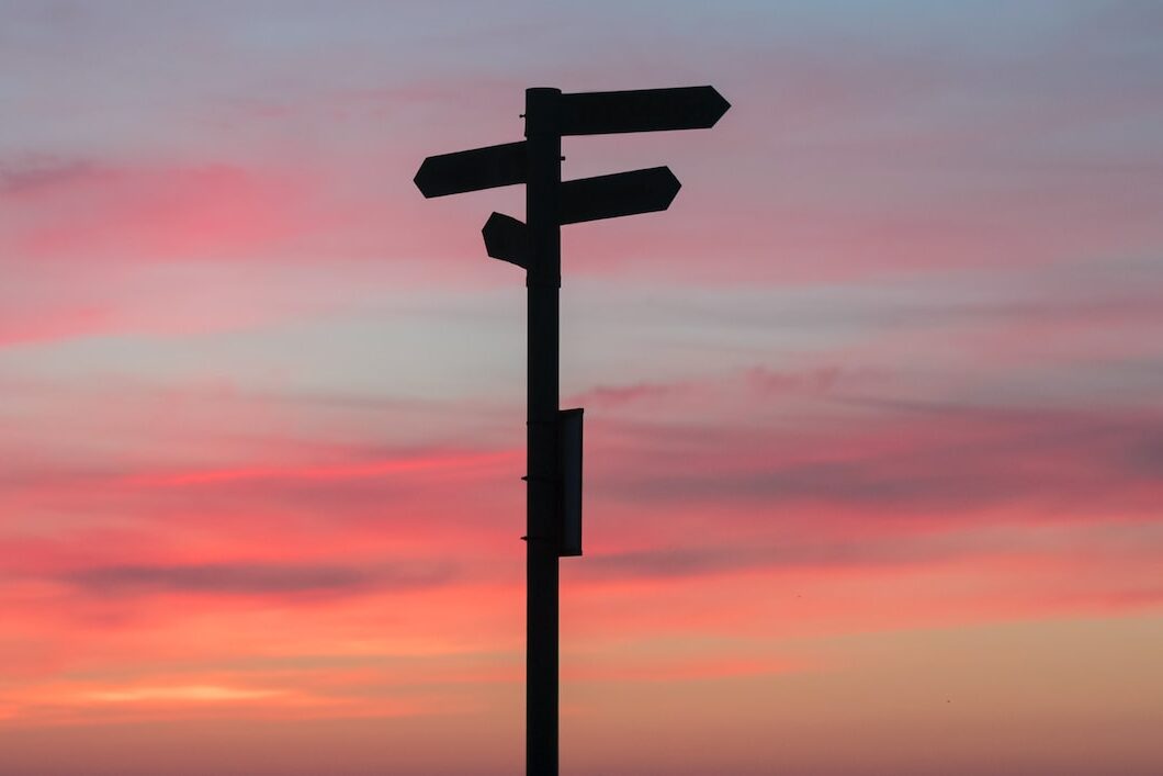 silhouette of road signage during golden hour